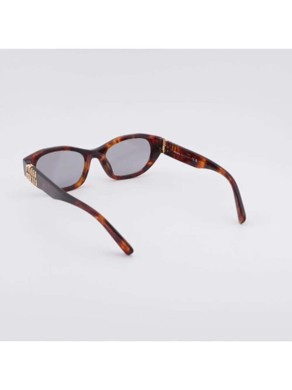 Miu Miu MUA03S 21C40O Sunglasses Havana Mahogany Oval Frame, Grey Lenses